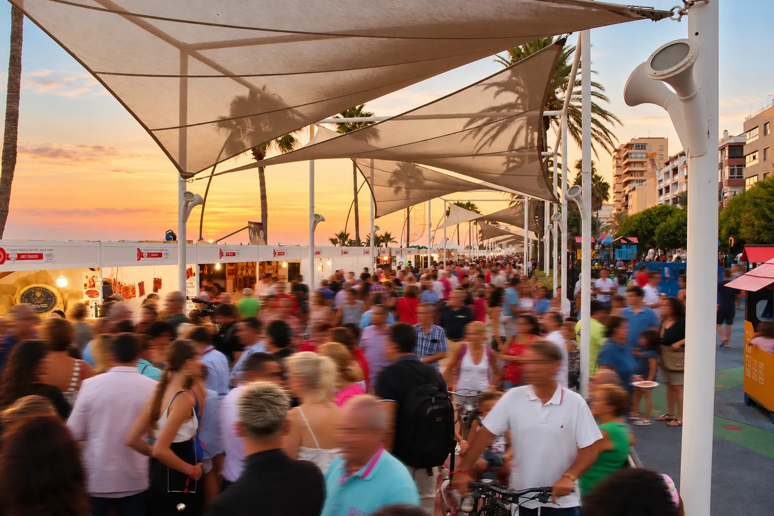 Visitors under the marquees of the Paseo Marítimo among the Certamen stands, 2018