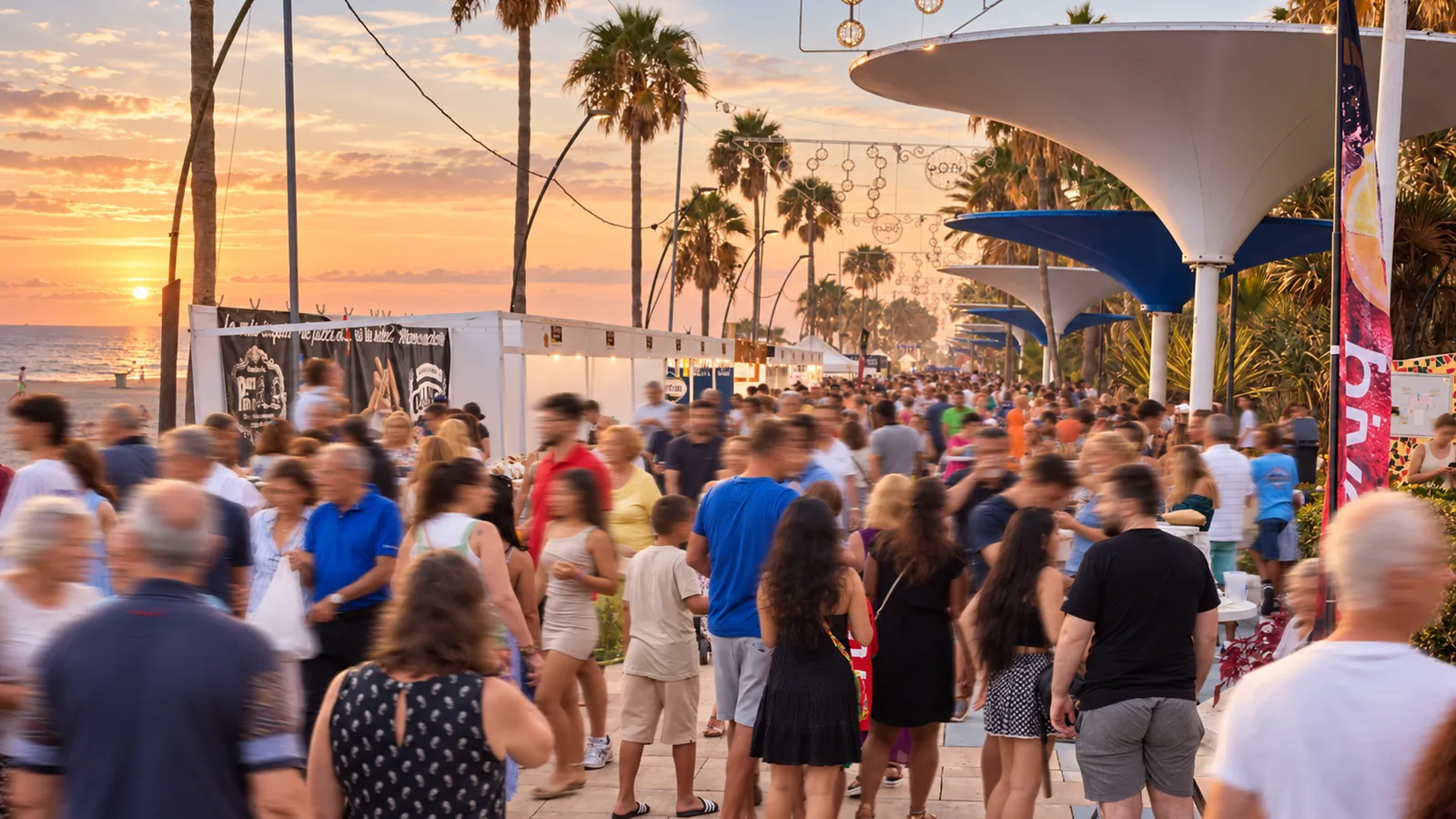 Crowds walking along the Paseo Marítimo among the stands of the eighth edition, 2023