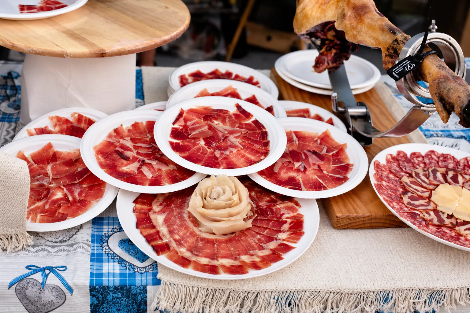Plates of freshly carved Iberian ham at the Popi World Ham Contest in Estepona
